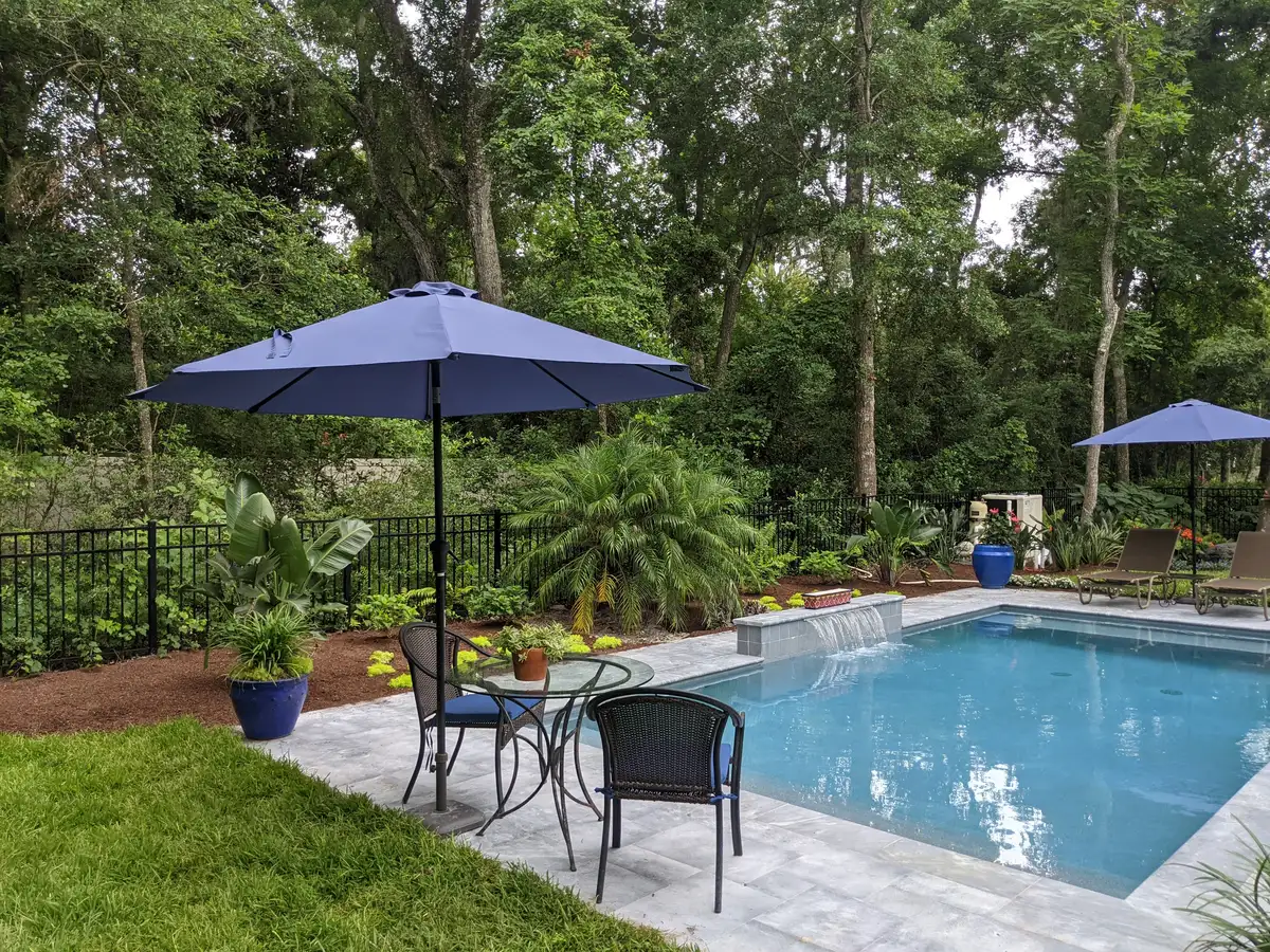 Outdoor living patio with stone terrace and seating area in Fernandina Beach