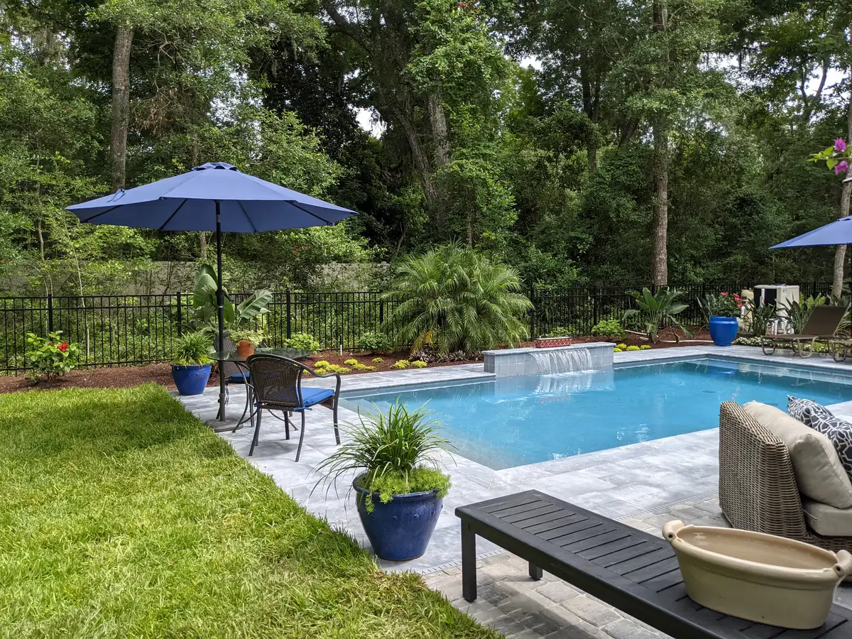 Native Florida garden with curved stone pathway in Yulee